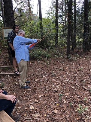 Royal aiming a bow.